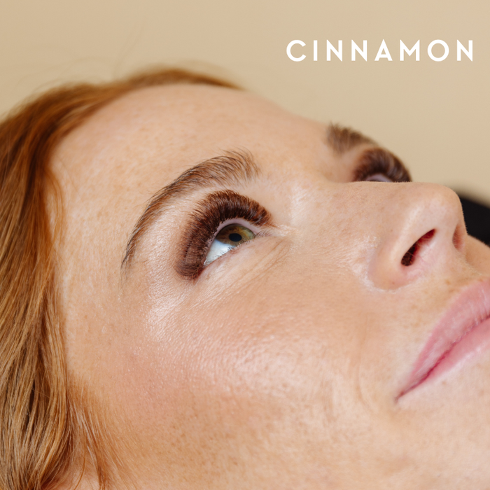 Model wearing EBL Cinnamon Brown Lash Extensions – light brown lashes with a natural finish, CC curl