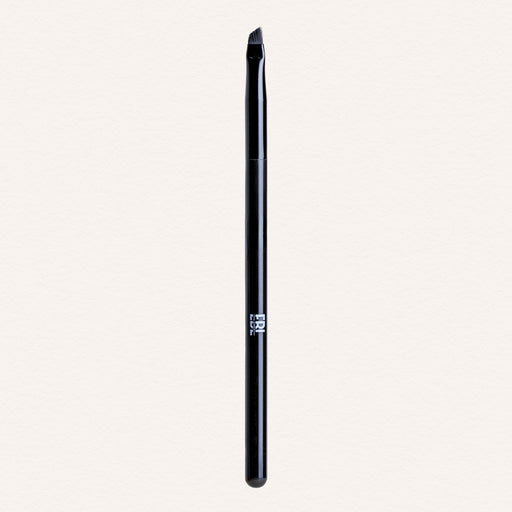 Black lash lift brush on a light gray background