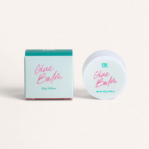 Round container of Korean Lash Lift glue balm with 'EBL Lashes' branding on a light beige background