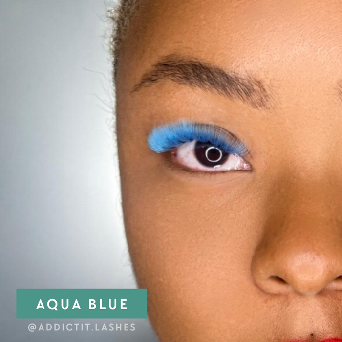 Model wearing EBL Aqua Blue Colored Lash Extensions – bright blue lashes for accent or full creative lash sets
