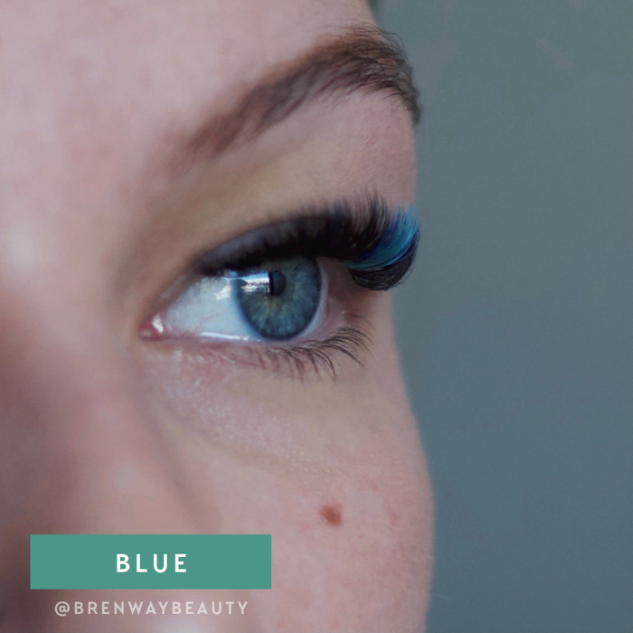 Model wearing EBL Blue Colored Lash Extensions – classic bold blue lashes blended with black for dimension