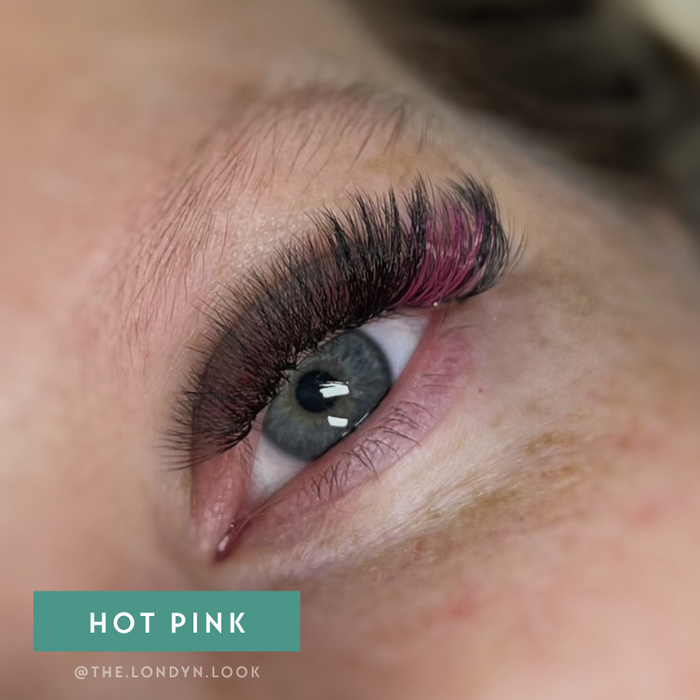 Close-up of model with EBL Hot Pink Colored Lash Extensions – accent lashes blended with black for a dramatic pop of color