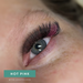 Close-up of model with EBL Hot Pink Colored Lash Extensions – accent lashes blended with black for a dramatic pop of color