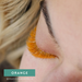 Close-up of model with EBL Orange Colored Lash Extensions – bold accent lashes for festivals and creative lash sets